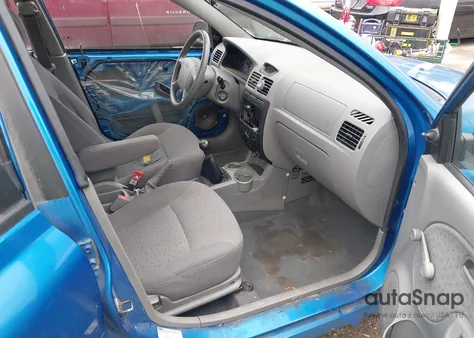 2003 Kia Rio z USA, uszkodzony, nr VIN KNADC125236235439